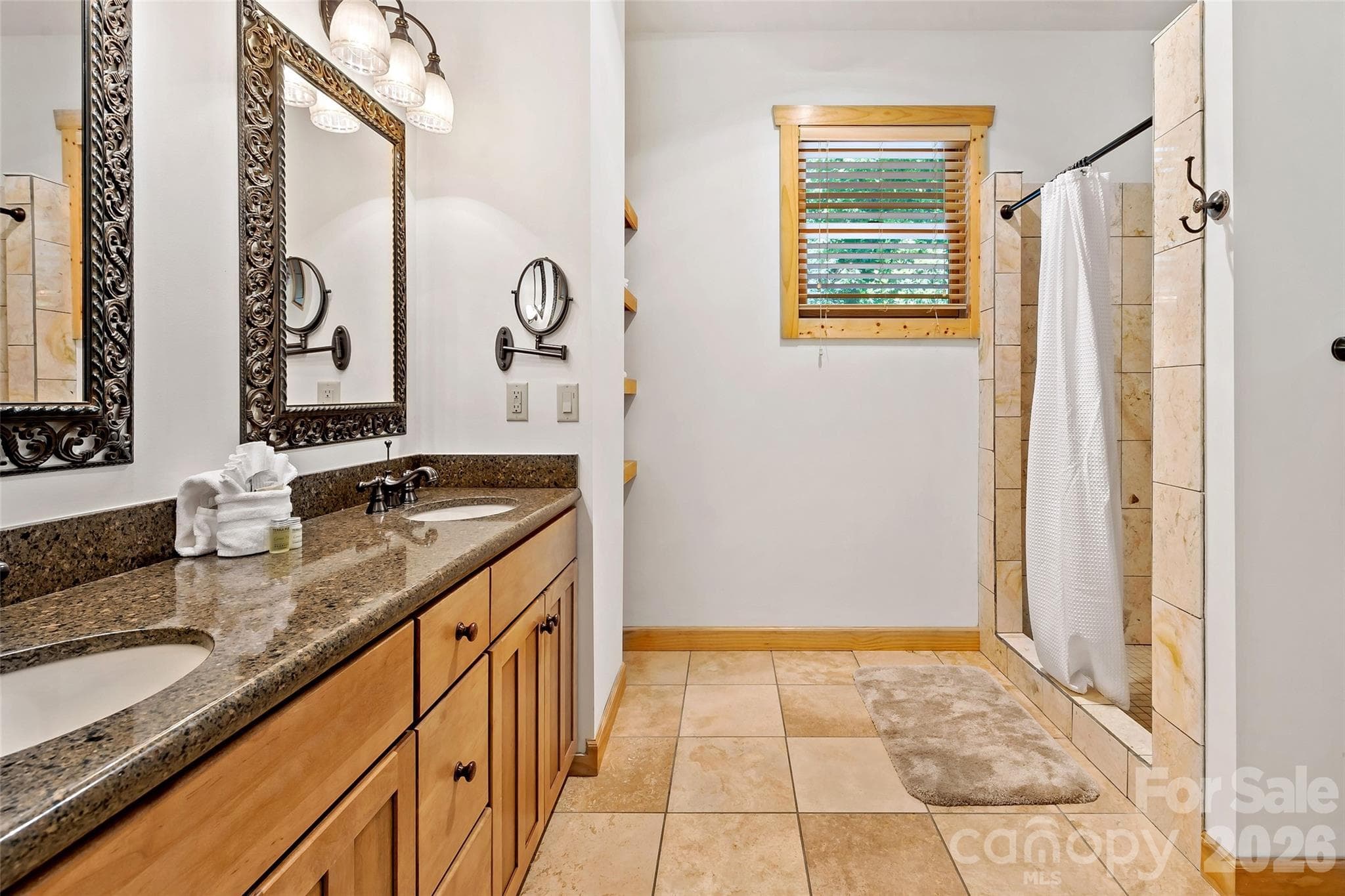 En suite bathroom for primary bedroom 1 located on the main level. - 179 Rock Spring Road, Lake Lure