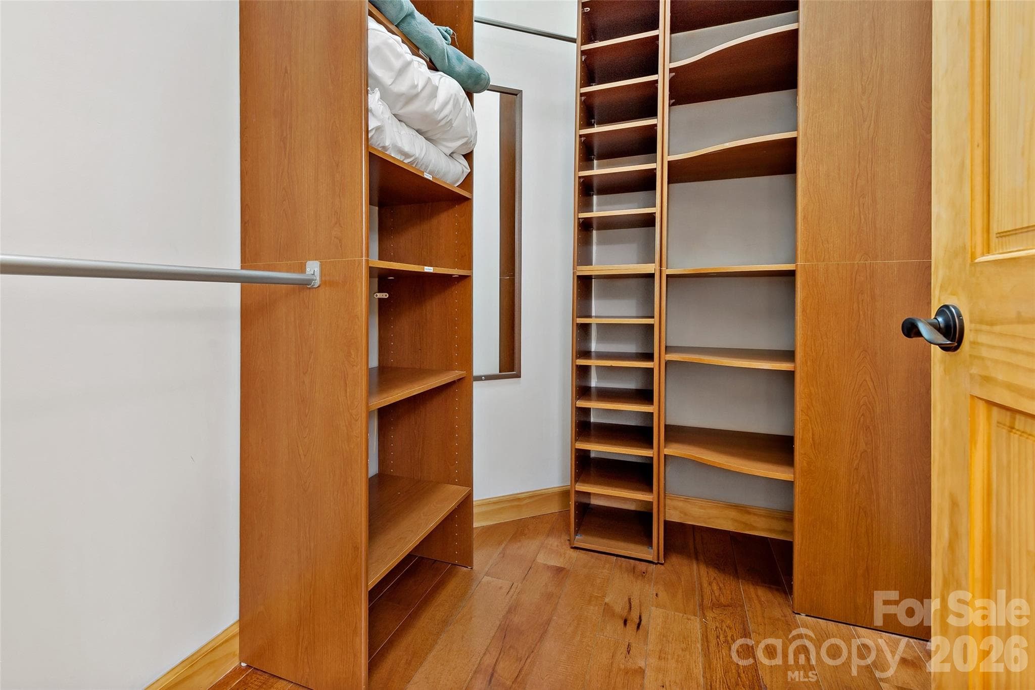 Main level bedrooms feature installed closet shelving and custom organizational systems. - 179 Rock Spring Road, Lake Lure
