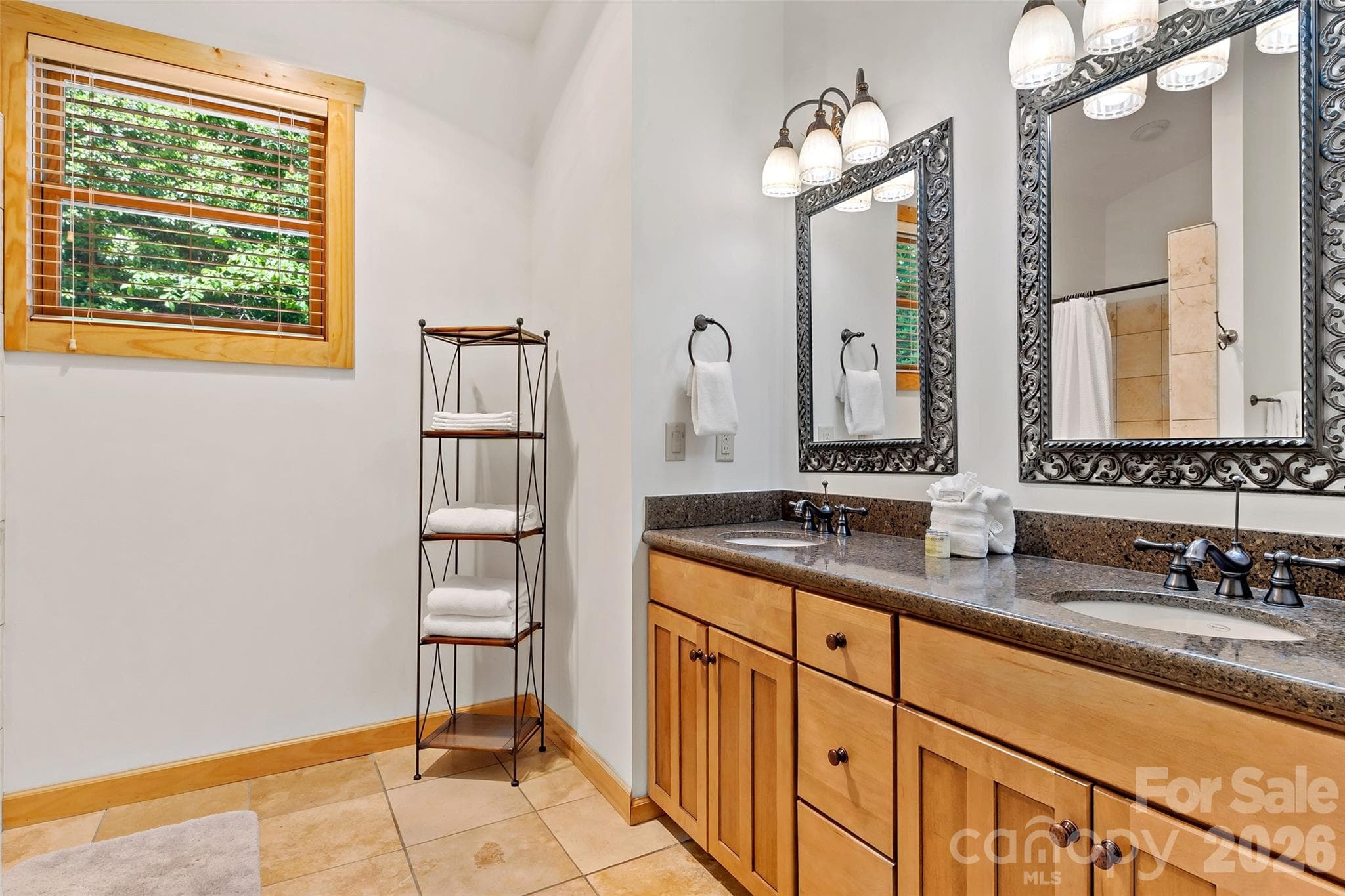 En suite bathroom for the second primary bedroom located on the main level. - 179 Rock Spring Road, Lake Lure
