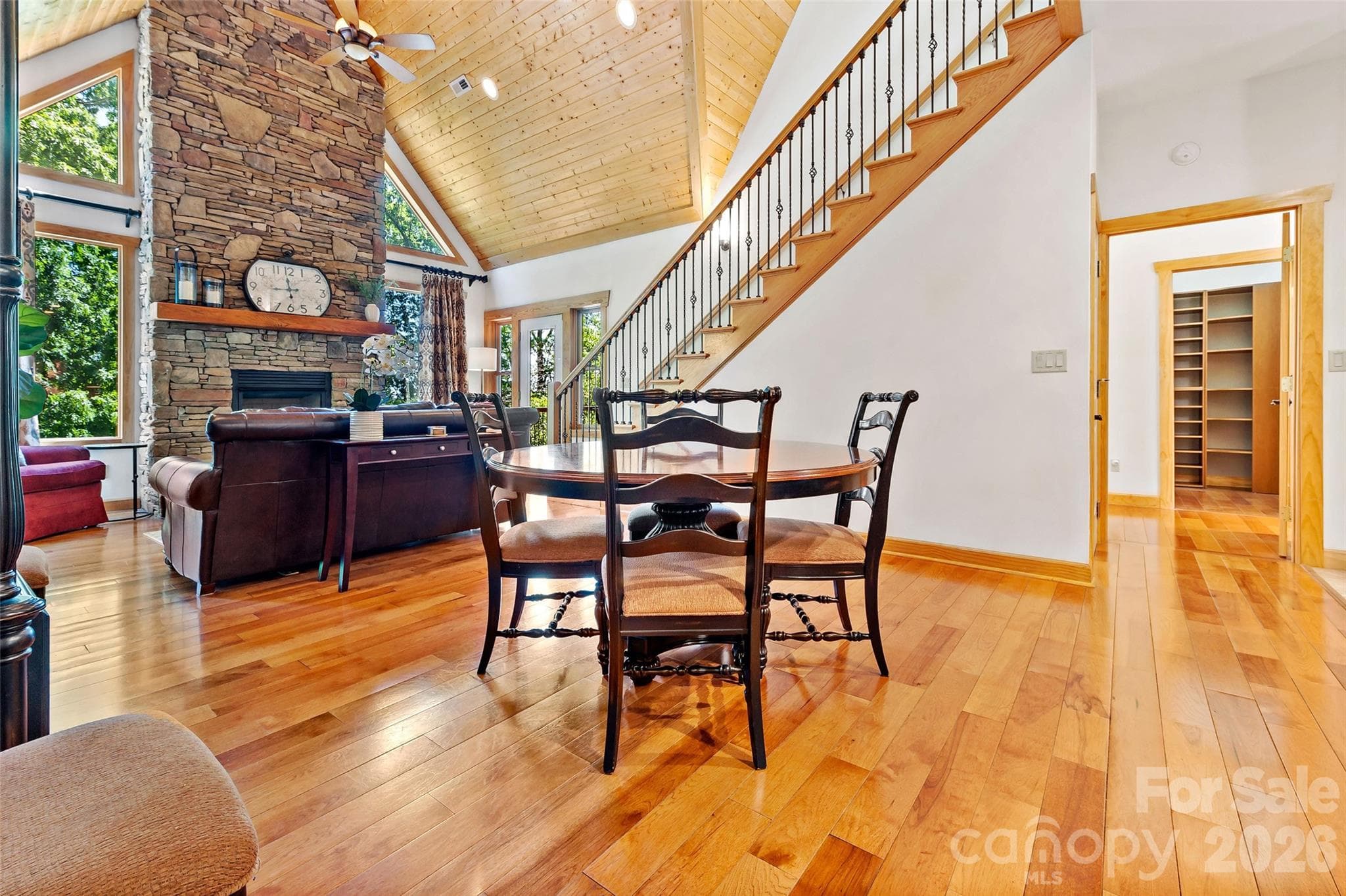 Open dining area connecting the kitchen and living room, conveniently located near both main-level bedrooms. - 179 Rock Spring Road, Lake Lure