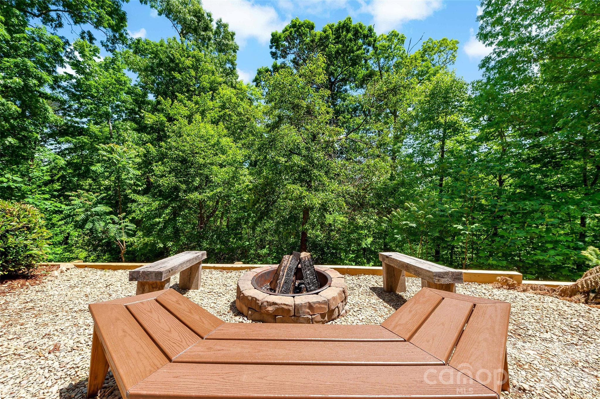 This home features an established firepit area, perfectly set up for you to move in and relax immediately. - 179 Rock Spring Road, Lake Lure