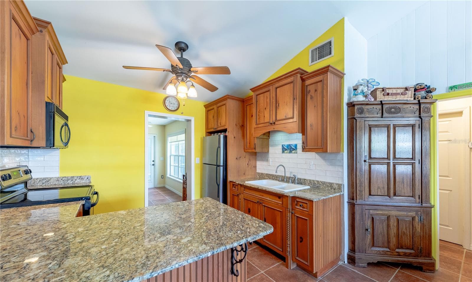 spacious functional kitchen with hand painted tiles. - 316 ALBA ST E, VENICE