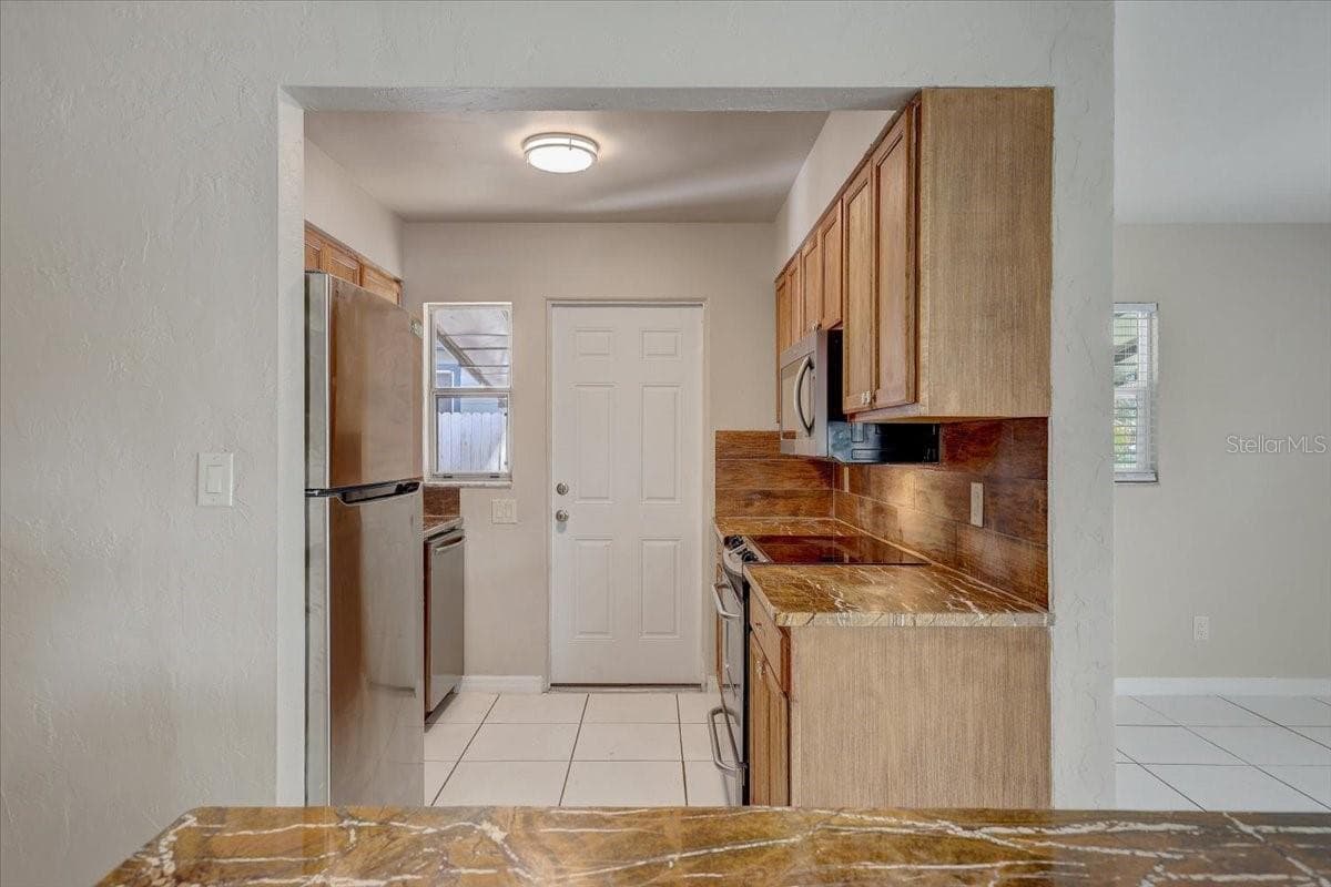 Kitchen with new appliances - 2901 DR MARTIN LUTHER KING JR ST S, ST PETERSBURG