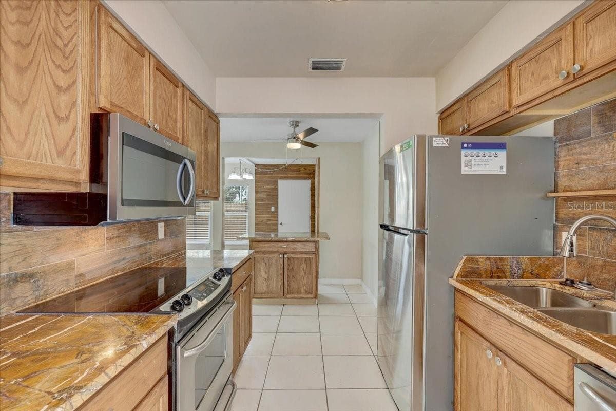 Kitchen with new stainless steel appliances - 2901 DR MARTIN LUTHER KING JR ST S, ST PETERSBURG