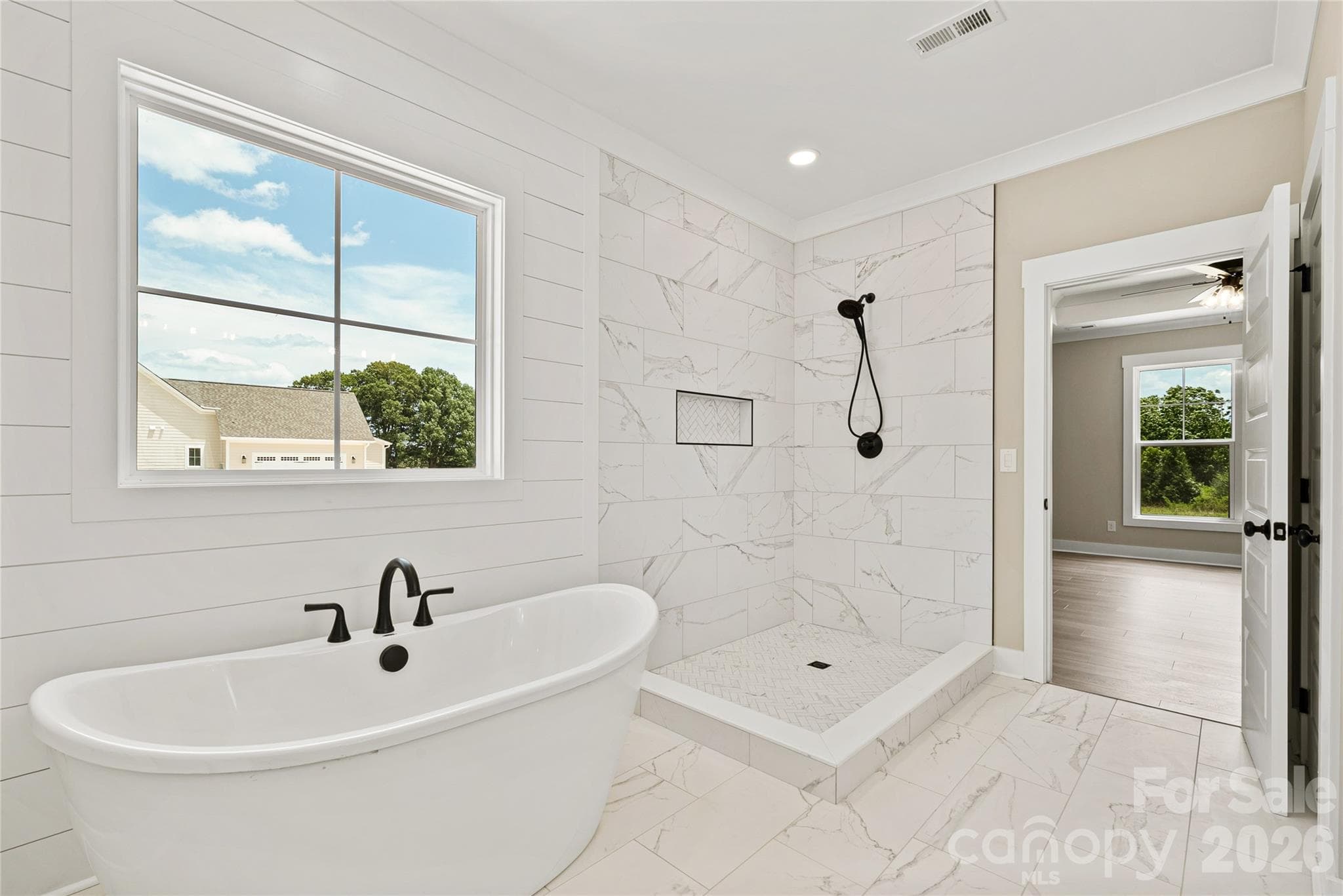 Primary bathroom- frameless shower door hasn't been installed yet - 5702 Love Mill Road, Monroe