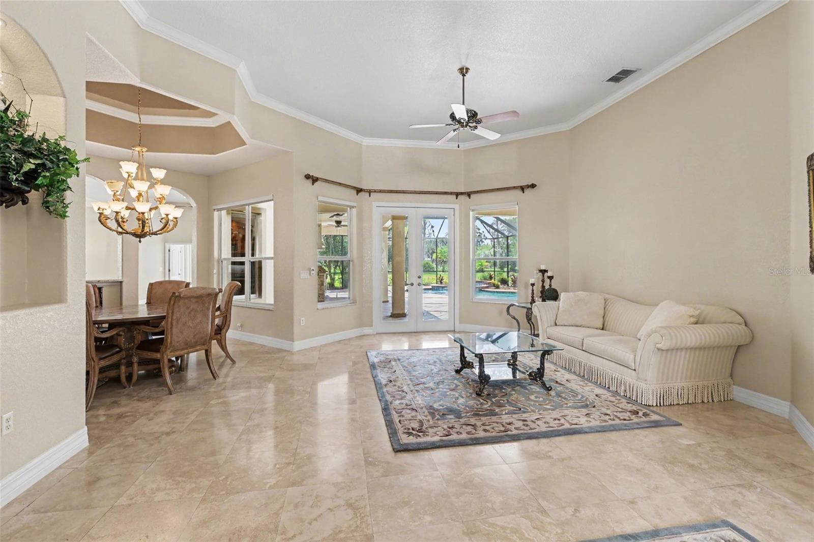 View from the front entry overlooking formal living out to the pool - 2912 HAMPTON PLACE CT, PLANT CITY