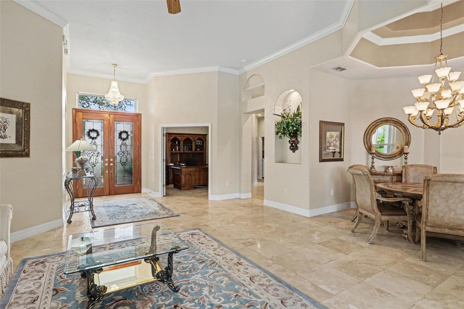 Travertine marble flows from the front door throughout the formal living and dining area - 2912 HAMPTON PLACE CT, PLANT CITY