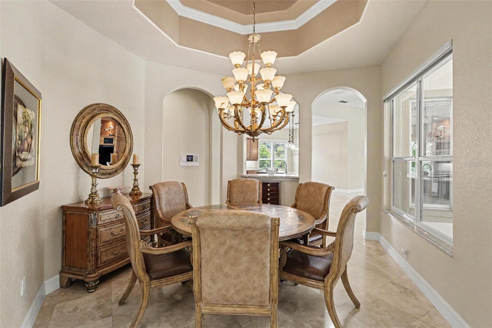 Elegant formal dining accented with tray ceiling and crown molding - 2912 HAMPTON PLACE CT, PLANT CITY