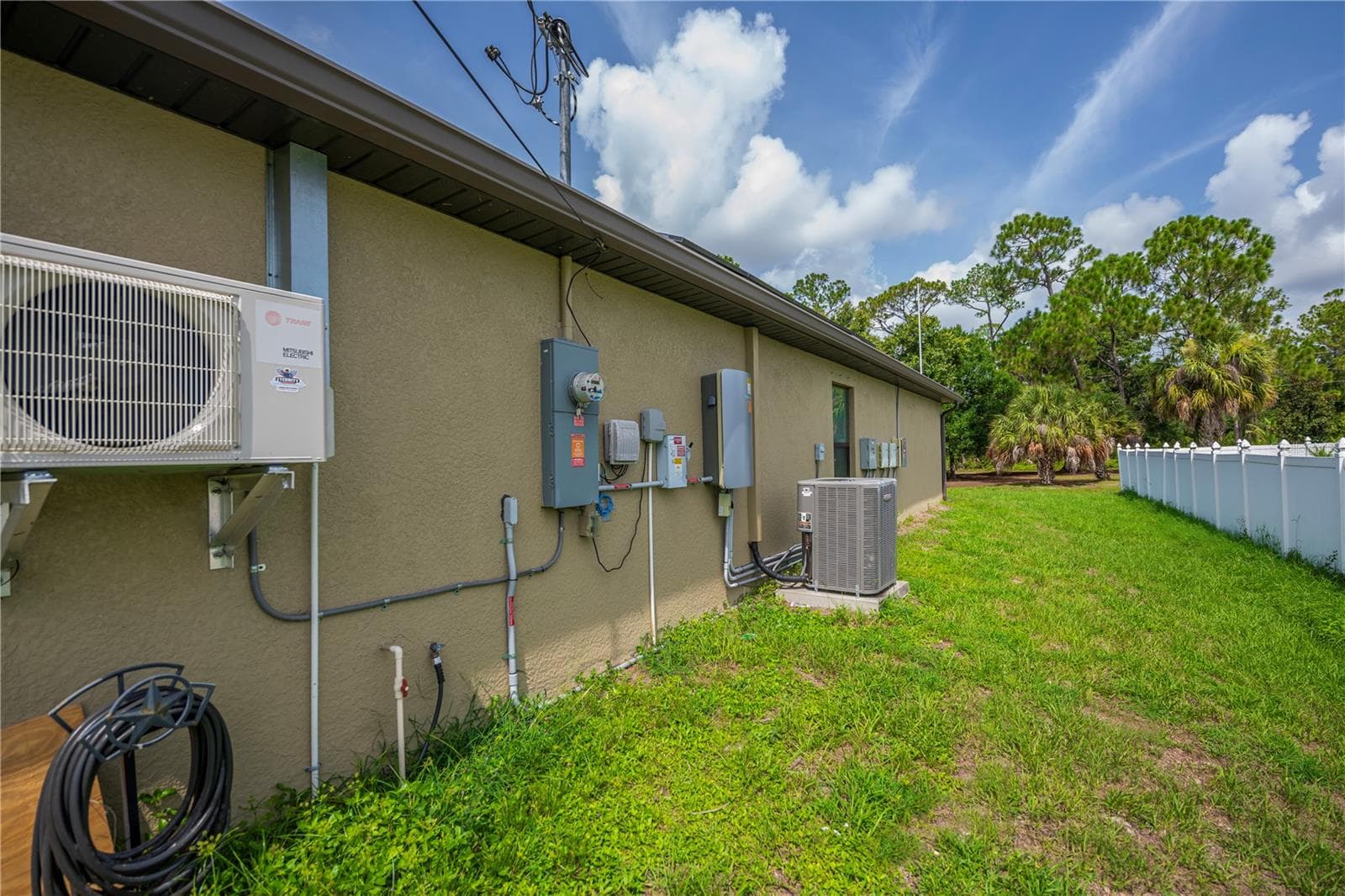 Side Exterior Showcasing A/C Unit and Utility Access - 2555 ATWATER DR, NORTH PORT