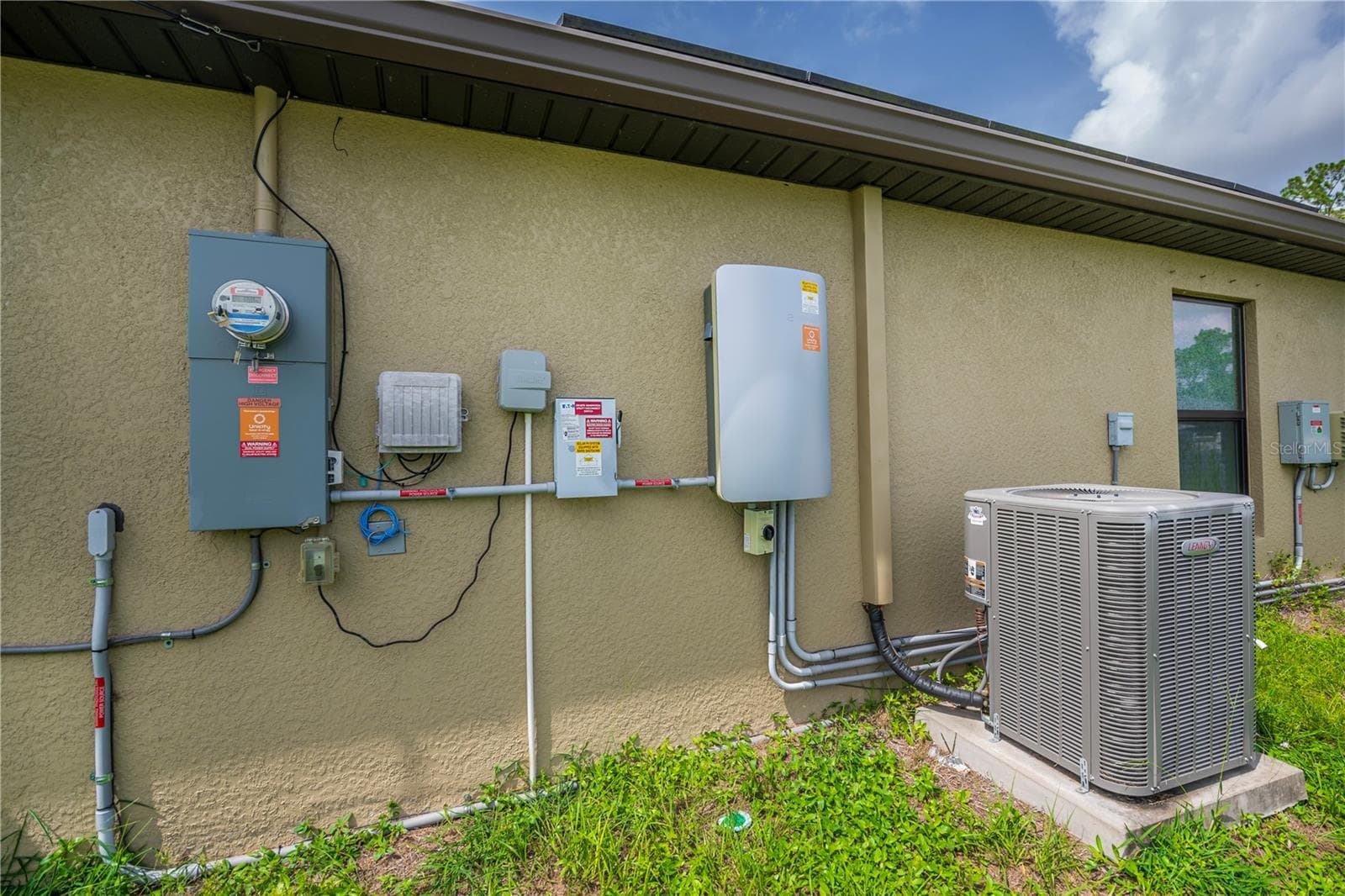 Side Exterior Showcasing A/C Unit and Utility Access - 2555 ATWATER DR, NORTH PORT