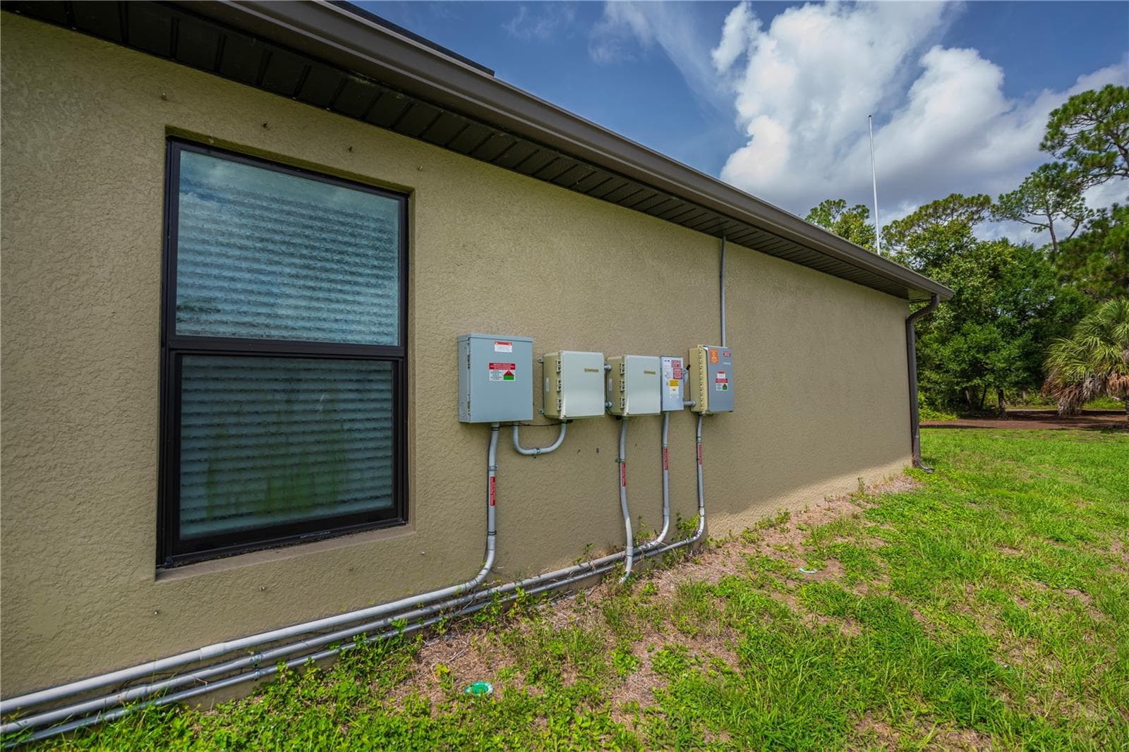 Side Exterior Showcasing A/C Unit and Utility Access - 2555 ATWATER DR, NORTH PORT