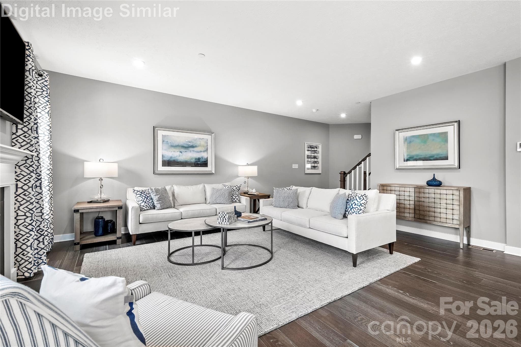 Spacious yet cozy great room with two oversized windows that pour in natural light. Seamlessly connected to the kitchen in an open floorplan—perfect for entertaining guests or curling up with a good book. - 11194 Emerson Landing Drive, Charlotte