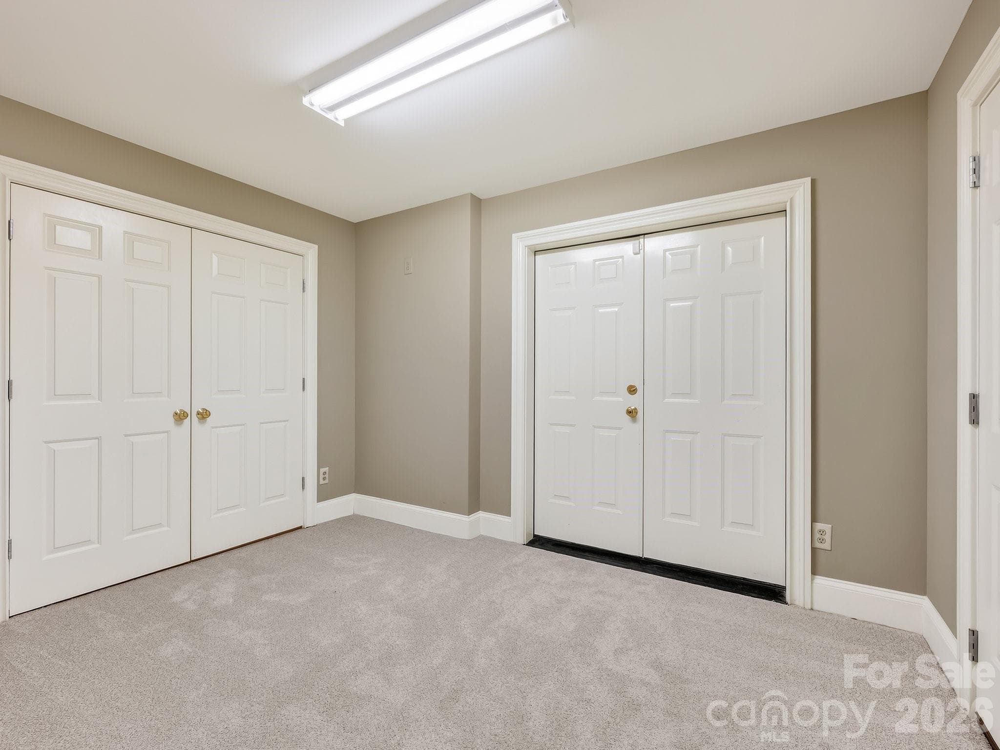 Lower level flex space with access to lower level 2 car garage - Charlotte