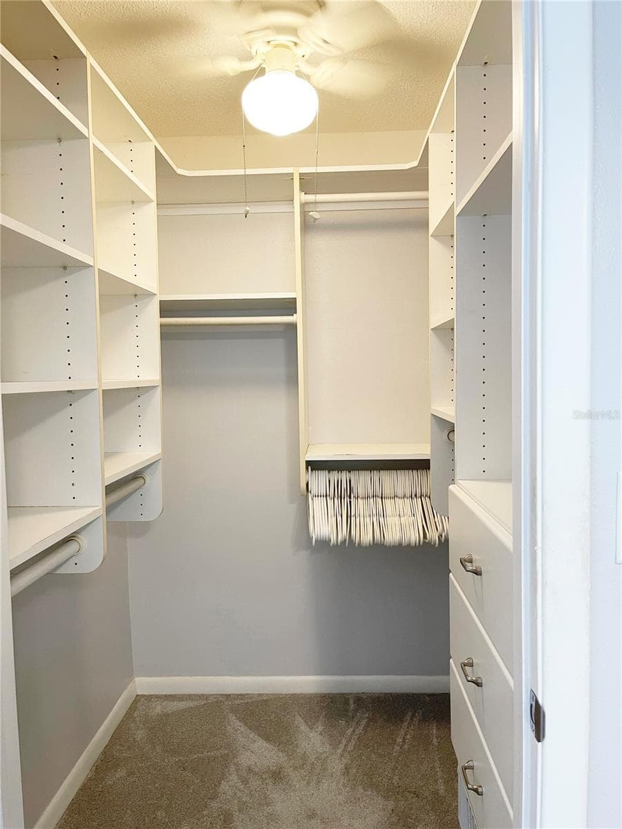 Custom built ins compliment the walk in closet - 5880 38TH AVE N #206, ST PETERSBURG
