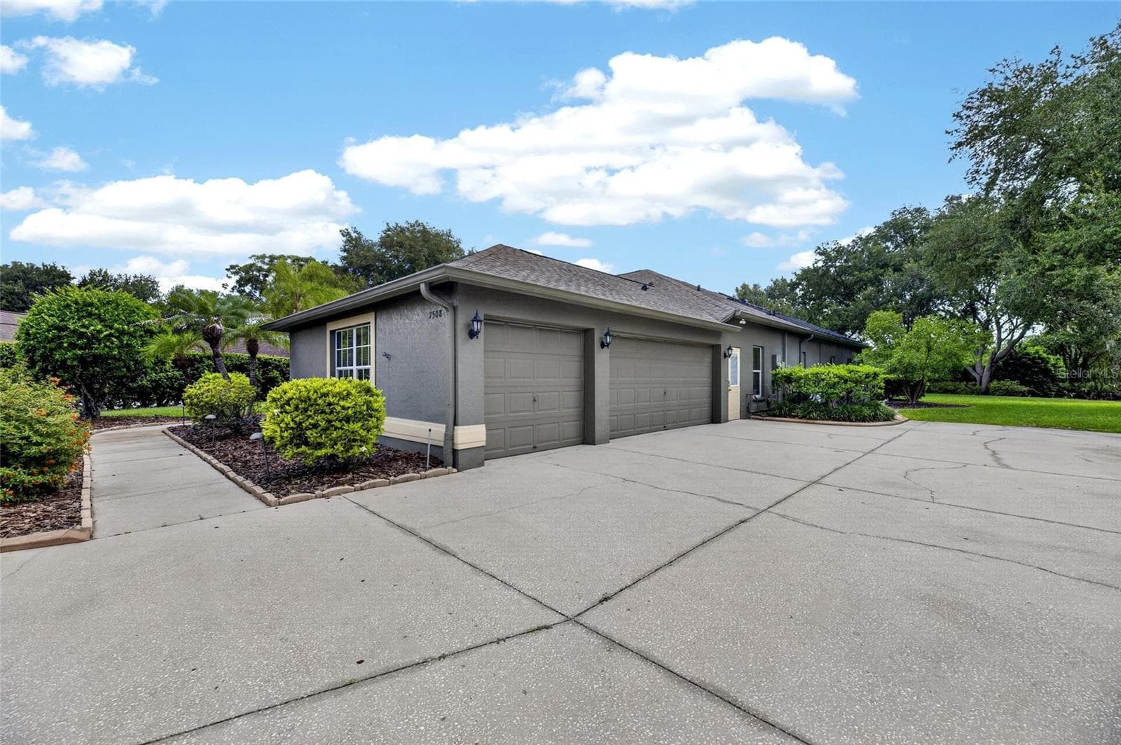 3 Car Garage side facing - 7508 DUNBRIDGE DR, ODESSA