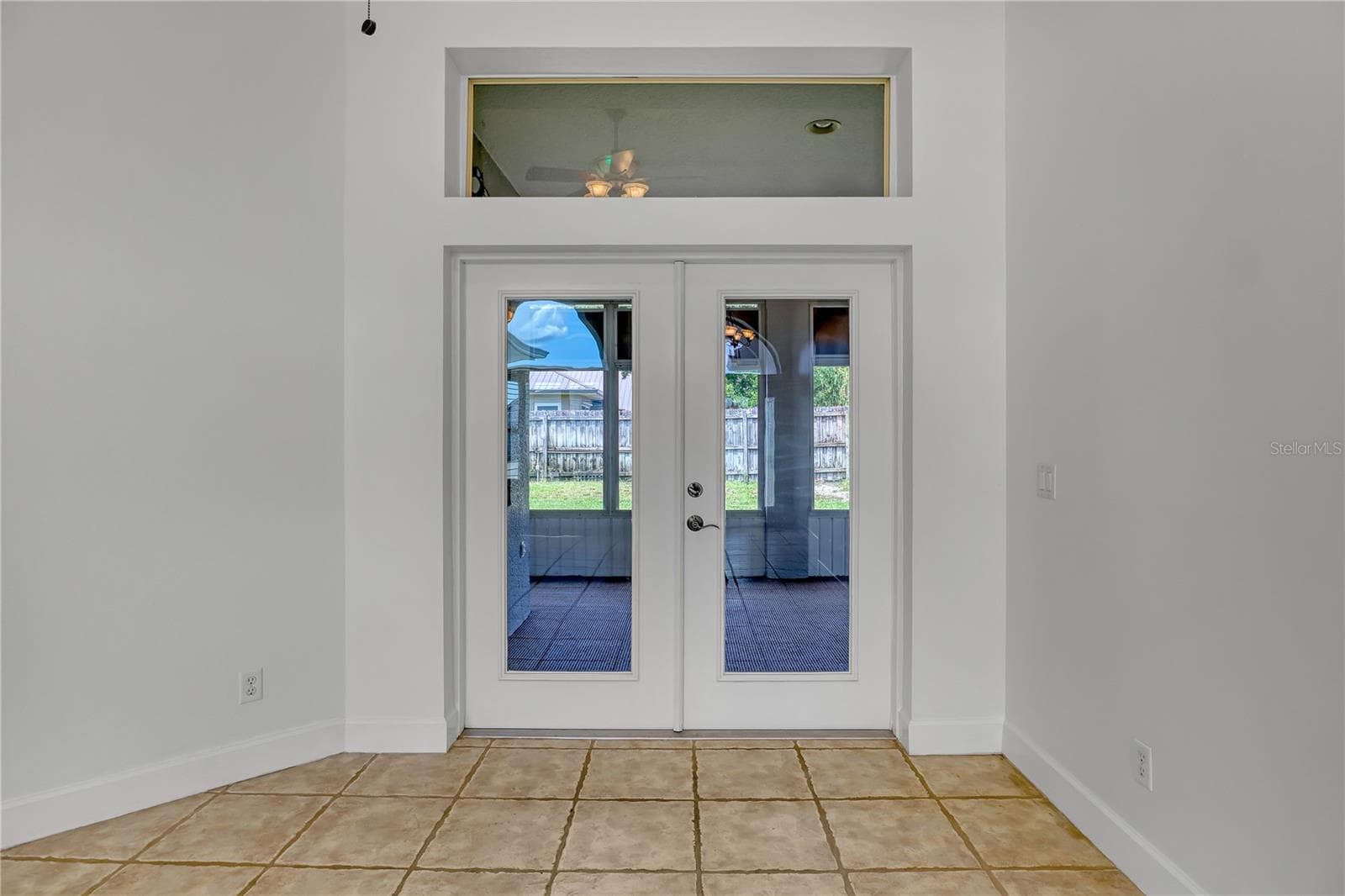 doors from Great room to Lanai - 4373 FLETCHER LN, TITUSVILLE