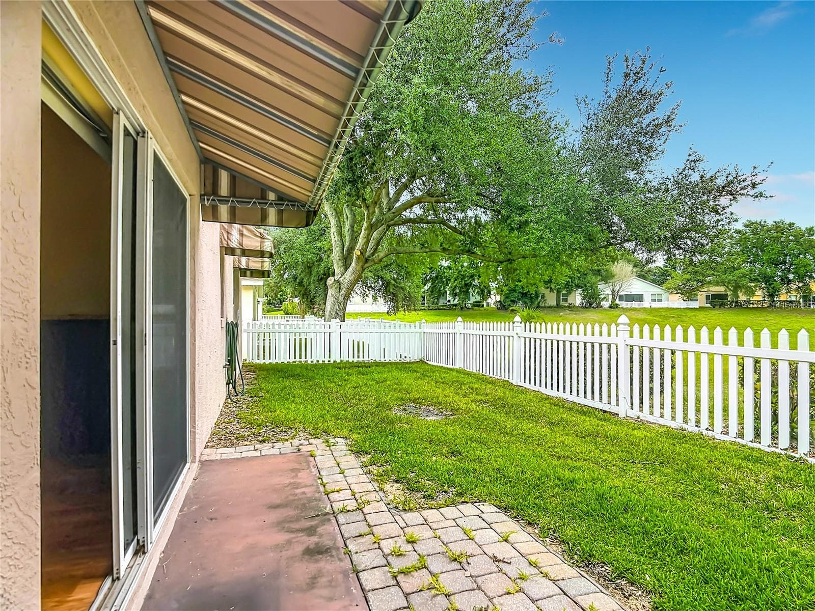 Glass sliding doors to backyard - 4178 CANNES AVE, LAKE WALES