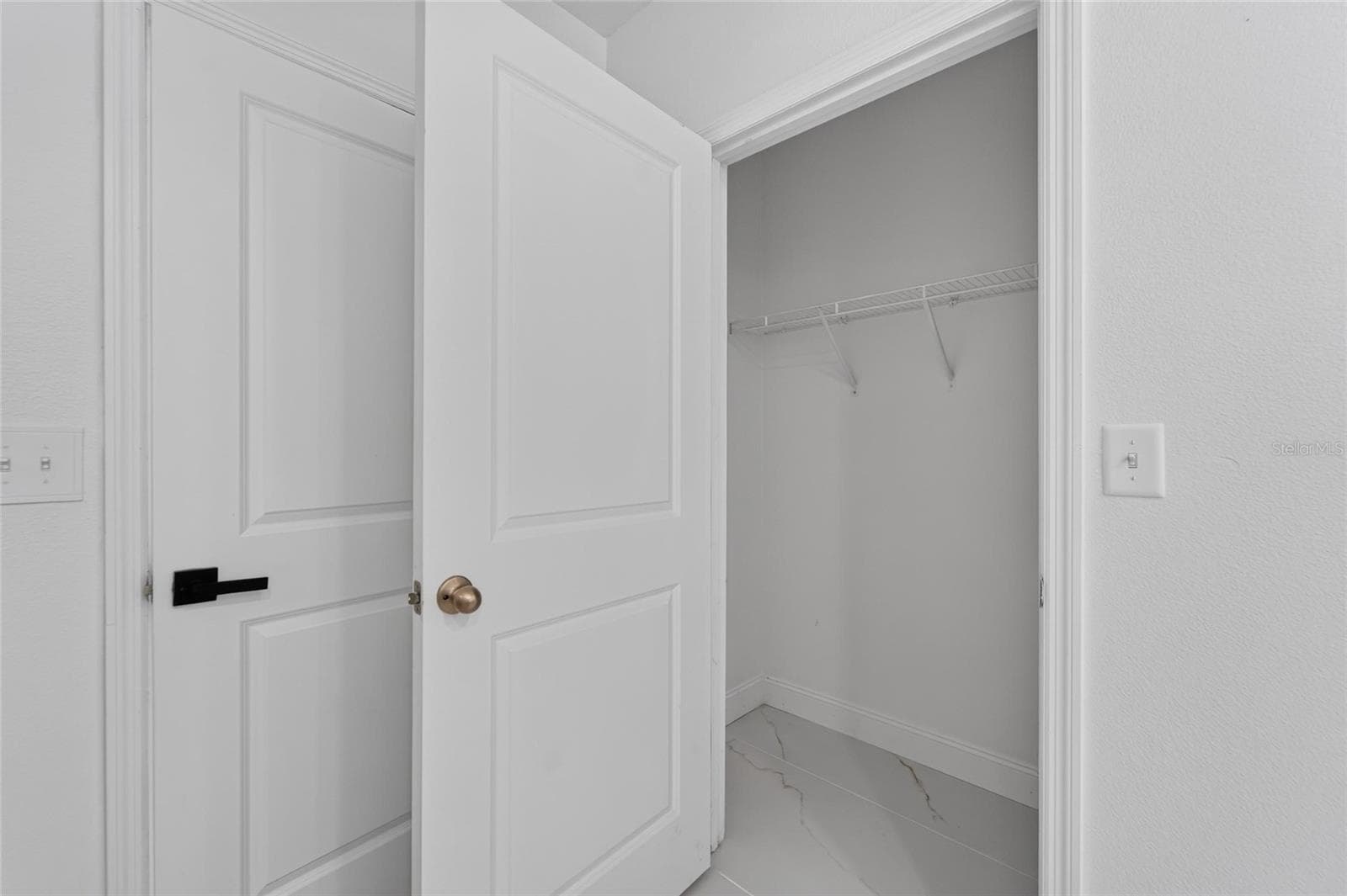 Primary Bedroom Closet 1 of 2 - 9637 TRONCAIS CIR, THONOTOSASSA