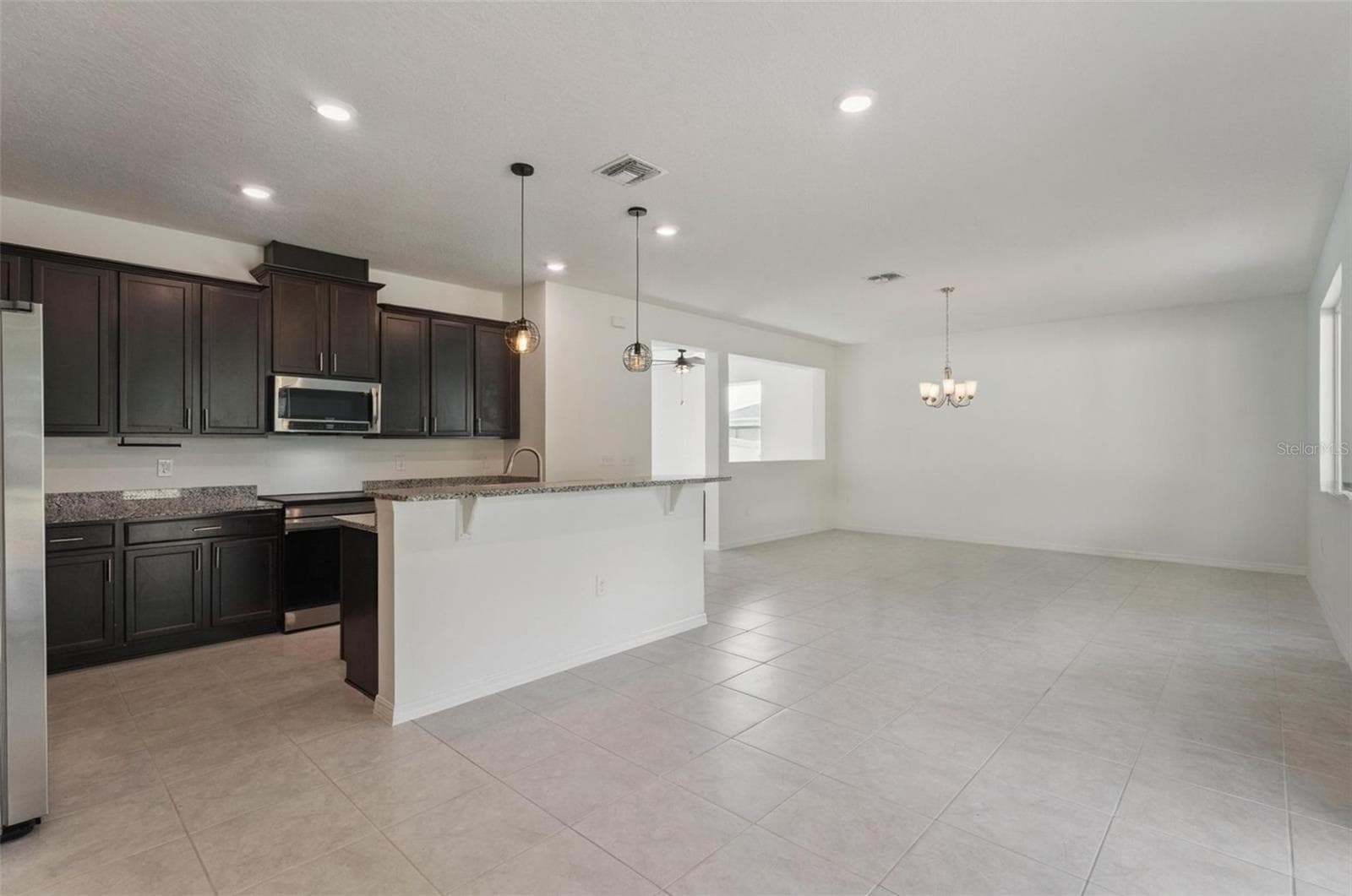 Dining room and kitchen - 15898 BRADICKS CT, CLERMONT