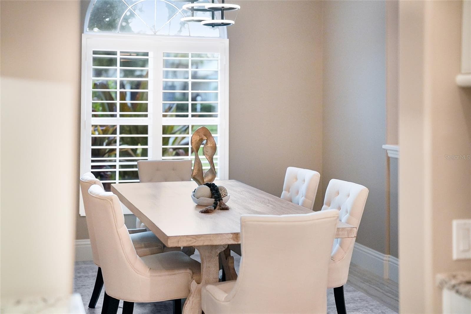 Formal dining room with volume ceilings and accent shiplap feature wall - 8122 LONE TREE GLN, LAKEWOOD RANCH