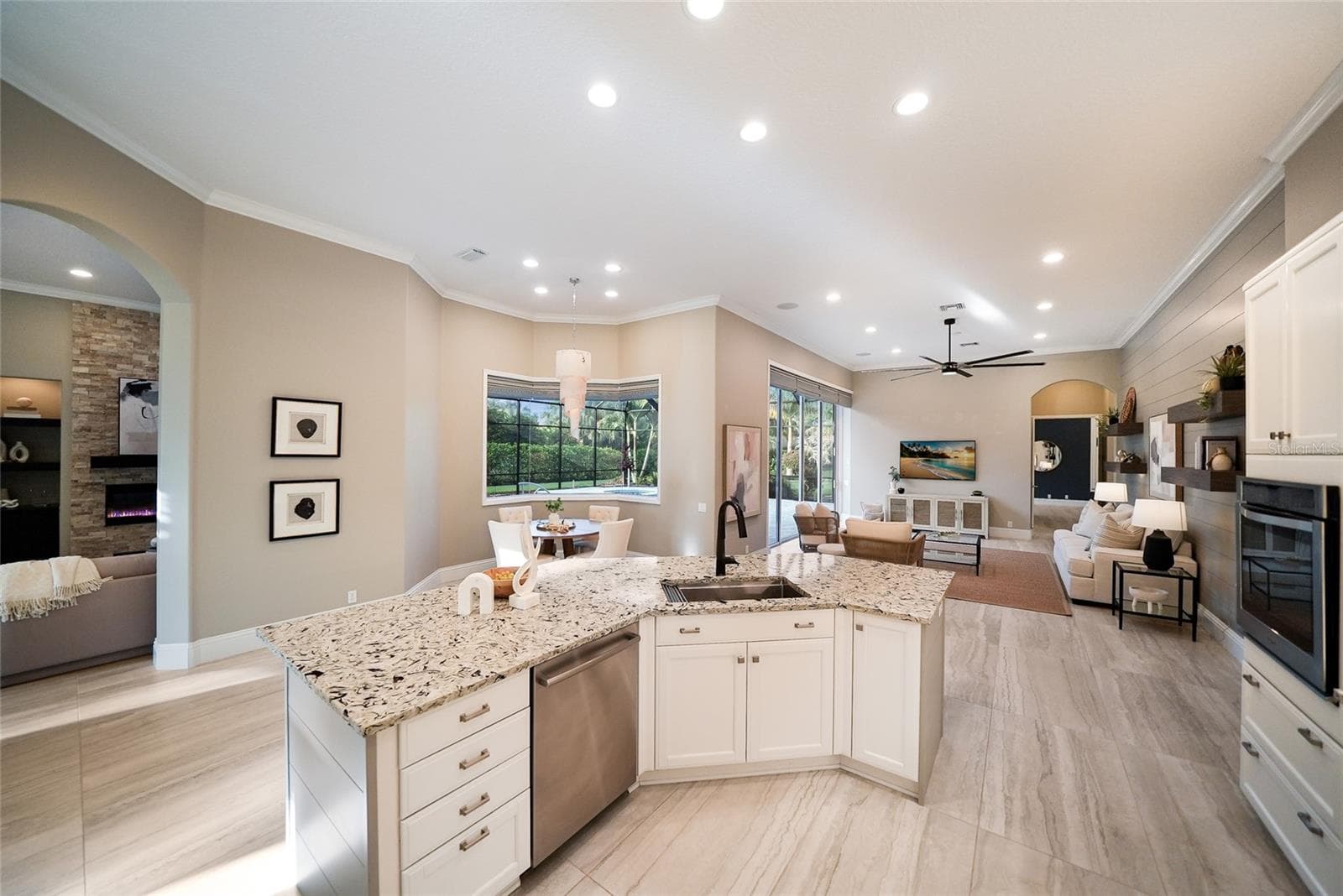 Brookhaven cabinetry and counter height stone island in updated Lakewood Ranch kitchen - 8122 LONE TREE GLN, LAKEWOOD RANCH