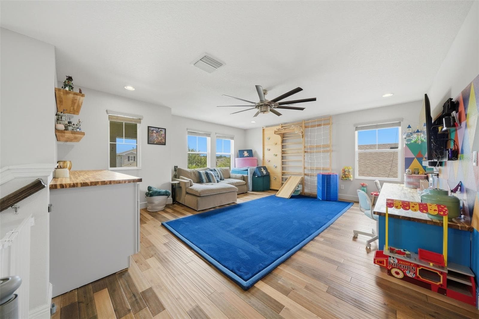 Upstairs, a spacious loft provides the perfect second living area, ideal as a media room, game room, playroom, or a comfortable retreat for family and guests. - 4801 BALLANTRAE BLVD, LAND O LAKES