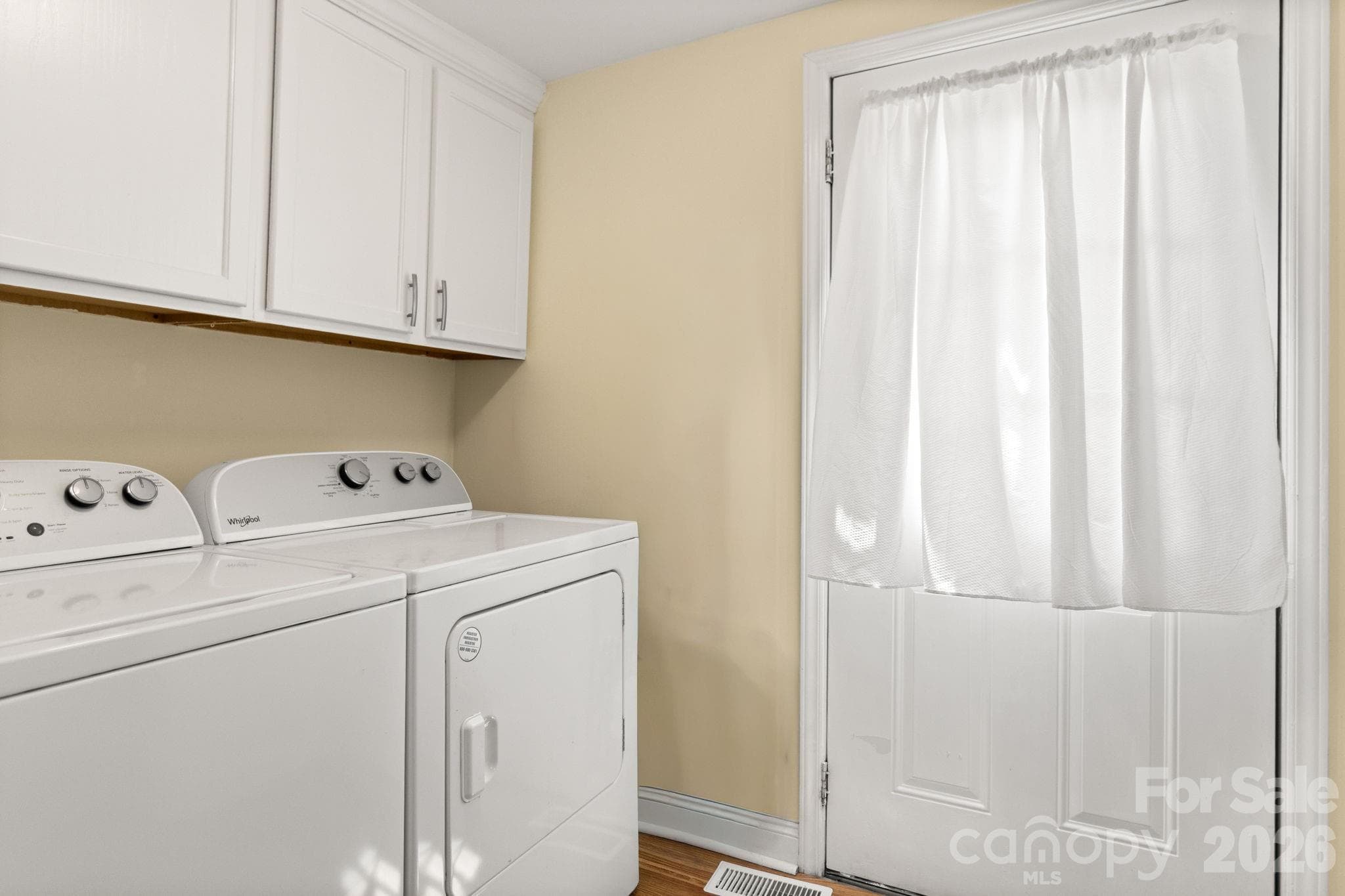 Laundry room with new cabinets, back door to walkout deck - 108 Richland Street, Clover