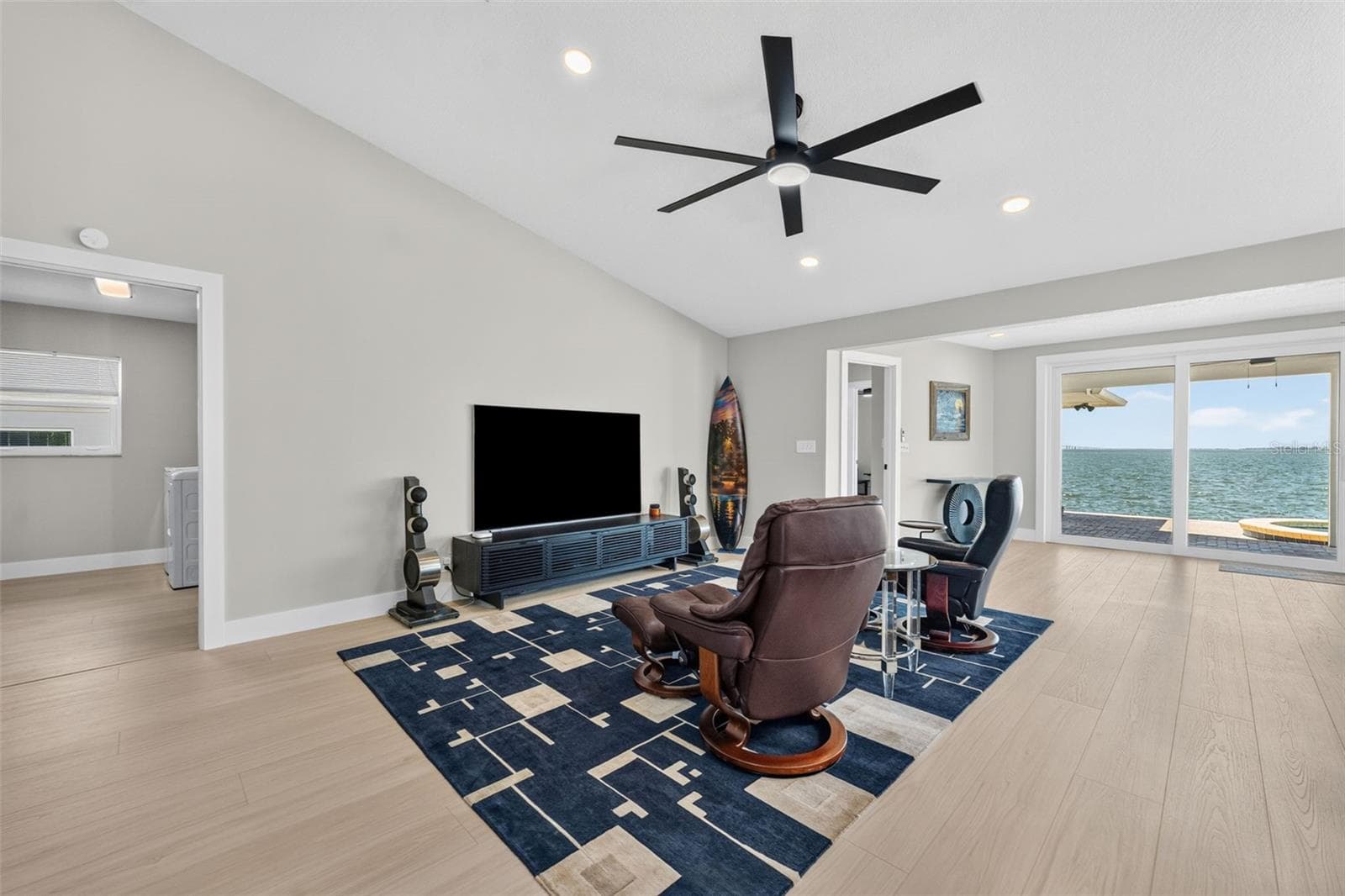 Spacious family room featuring vaulted ceilings and recessed lighting for an open, airy feel. - 2936 68TH AVE S, ST PETERSBURG