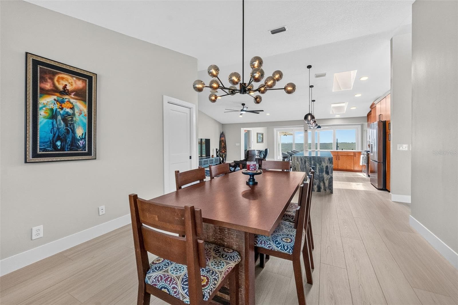 Spacious dining room with easy access to a walk-in pantry, perfect for hosting dinners and everyday meals. - 2936 68TH AVE S, ST PETERSBURG