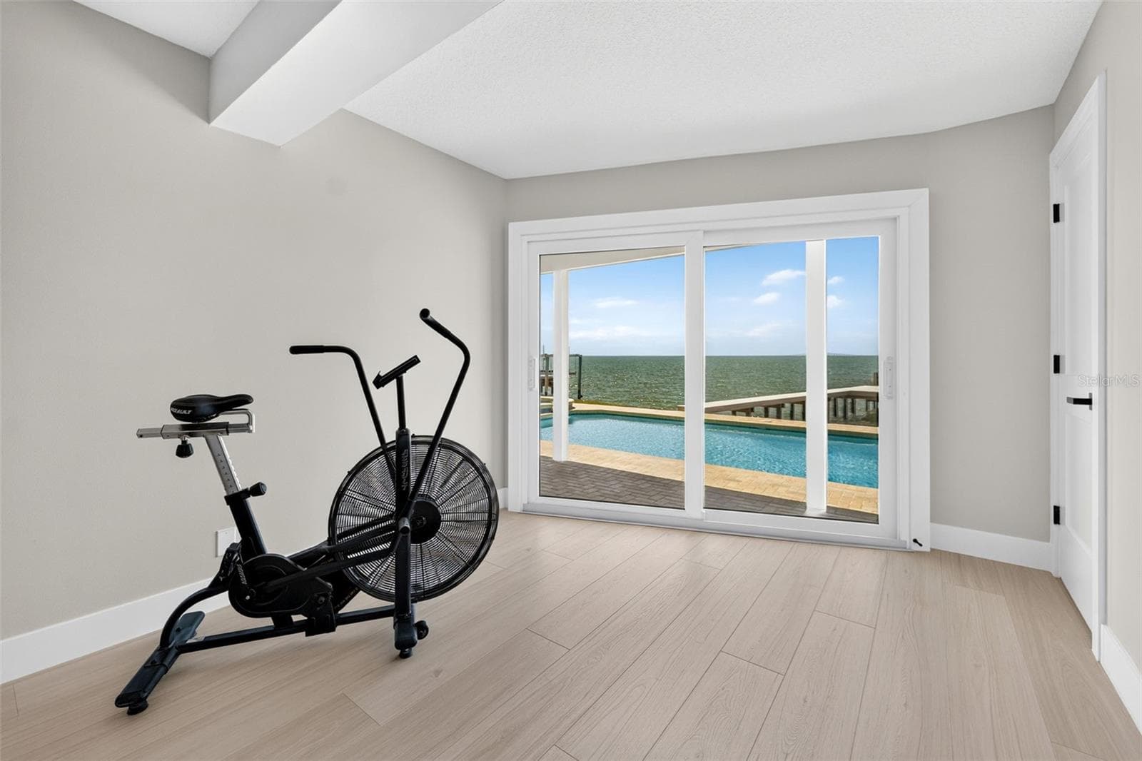 Versatile bonus space in the primary bedroom, perfect for a reading nook, workout area, or personalized retreat. - 2936 68TH AVE S, ST PETERSBURG