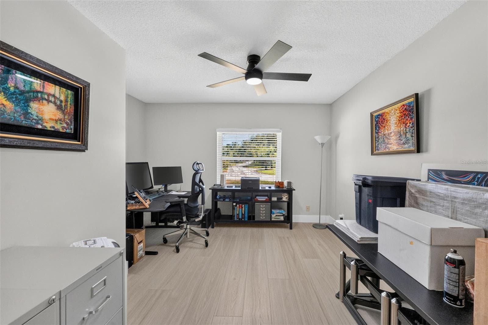 Bedroom 2 featuring luxury vinyl plank floors, offering a bright and inviting space for family, guests, or as an office. - 2936 68TH AVE S, ST PETERSBURG