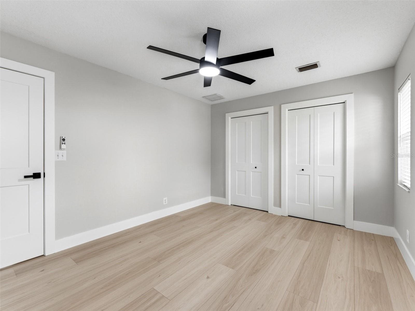 Bedroom 4 with custom closets by closet by design. - 2936 68TH AVE S, ST PETERSBURG