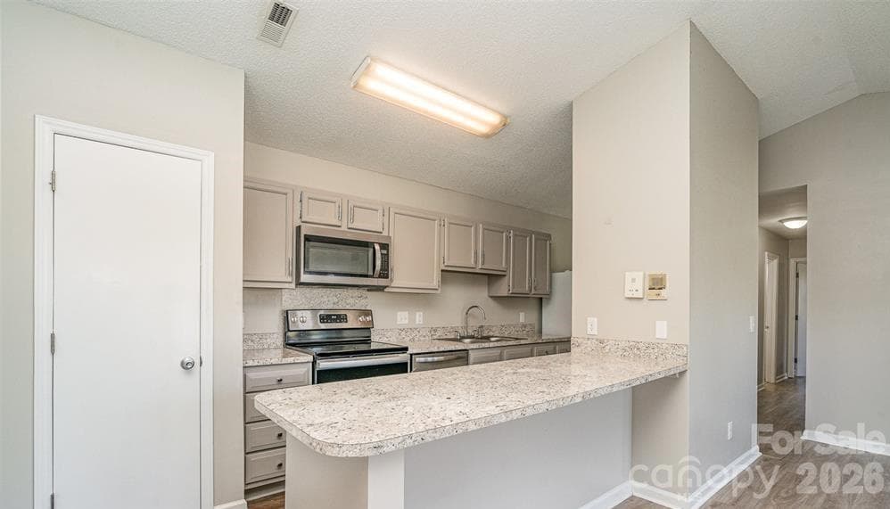Breakfast bar or extra counter space - 6165 Meadow Rose Lane, Charlotte