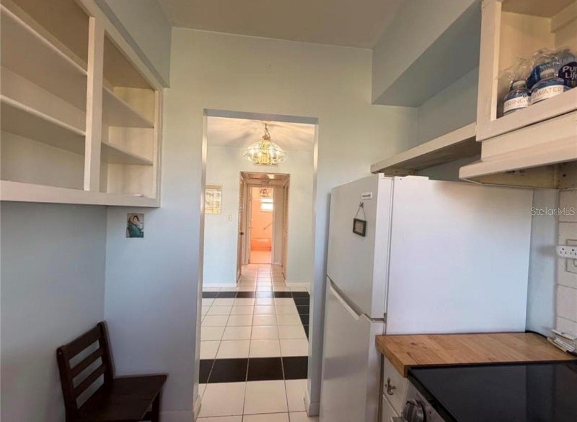 Kitchen 9X7 with open shelving - 3009 N HALIFAX AVE #2, DAYTONA BEACH