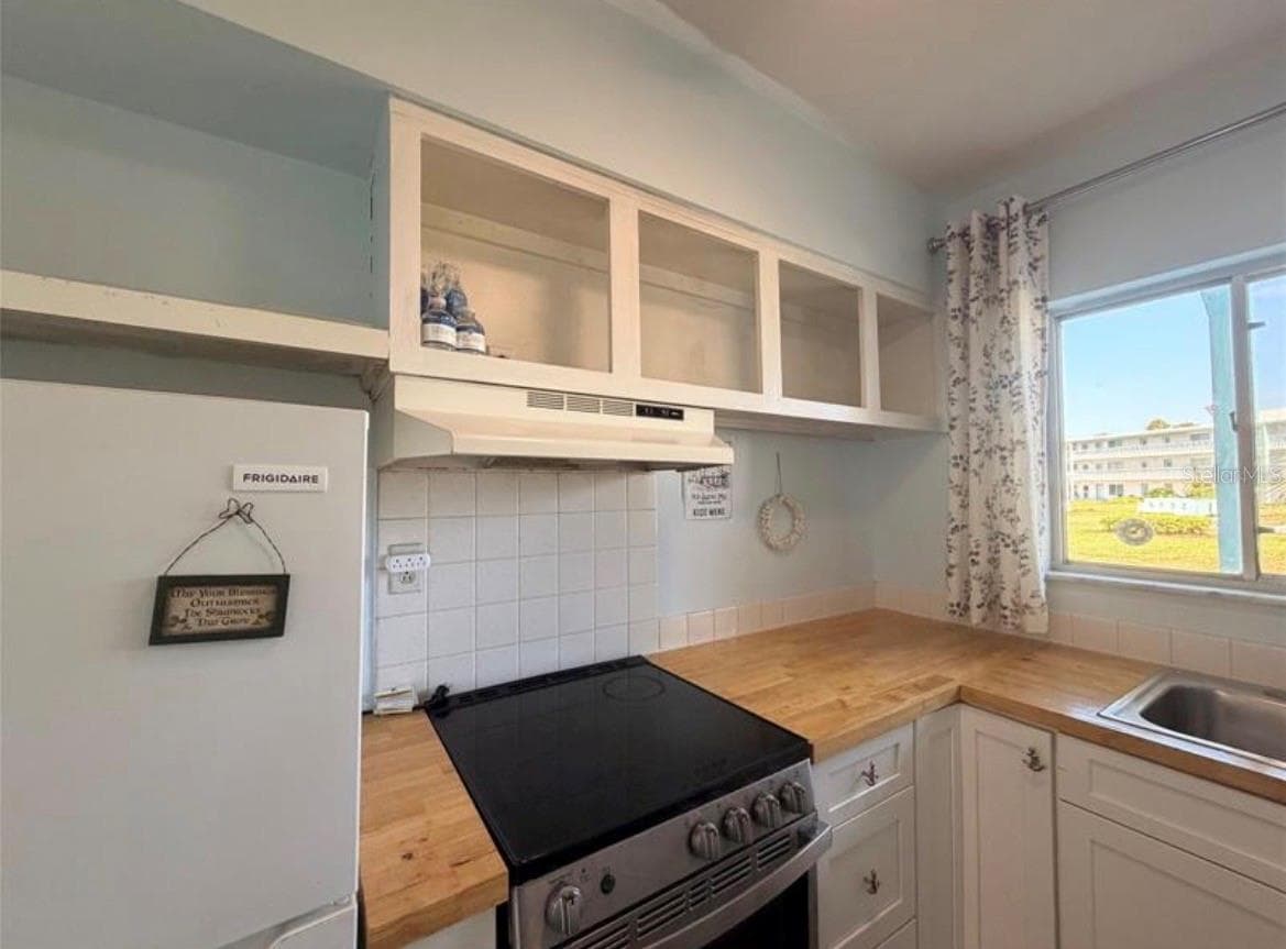 Kitchen 9X7 with open shelving - 3009 N HALIFAX AVE #2, DAYTONA BEACH
