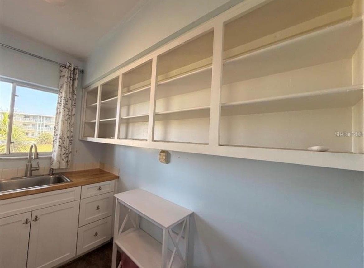 Kitchen 9X7 with open shelving - 3009 N HALIFAX AVE #2, DAYTONA BEACH
