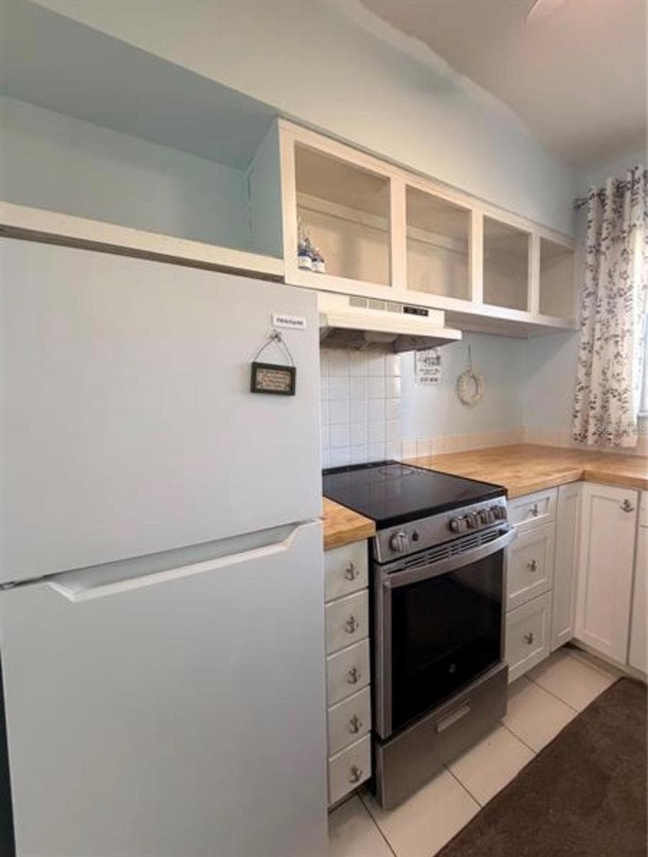 Kitchen 9X7 with open shelving - 3009 N HALIFAX AVE #2, DAYTONA BEACH
