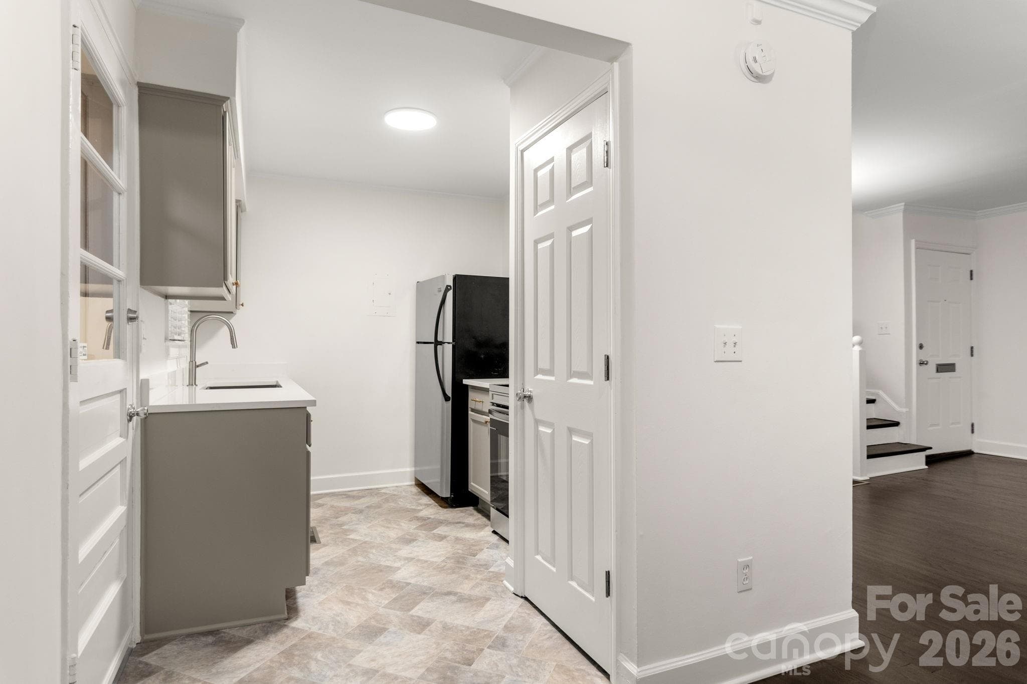 New cabinets and quartz countertops! Kitchen overlooks back yard - 212 Wakefield Drive, Charlotte