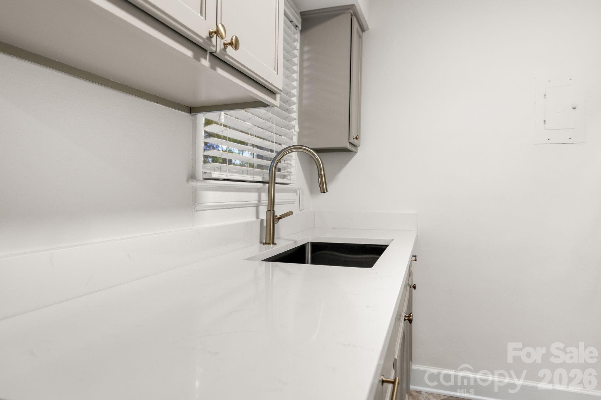New cabinets and quartz countertops! Kitchen overlooks back yard - 212 Wakefield Drive, Charlotte