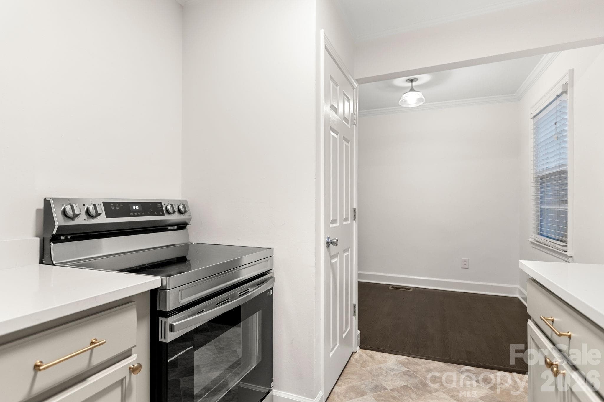 New cabinets and quartz countertops! Kitchen overlooks back yard - 212 Wakefield Drive, Charlotte