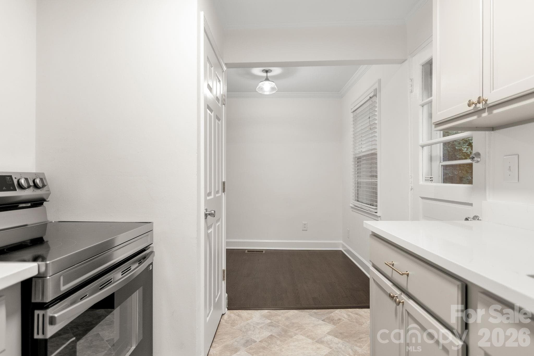 New cabinets and quartz countertops! Kitchen overlooks back yard - 212 Wakefield Drive, Charlotte