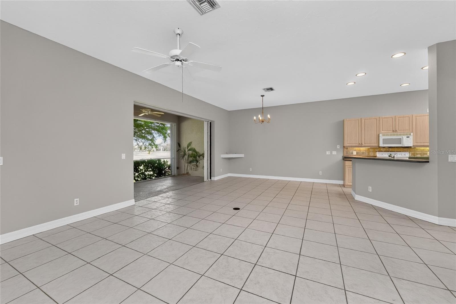 Great room and dining area. - 1611 ATARES DRIVE #Unit 111, PUNTA GORDA