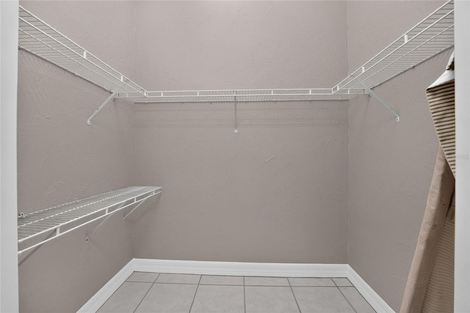 Master walk-in closet. - 1611 ATARES DRIVE #Unit 111, PUNTA GORDA