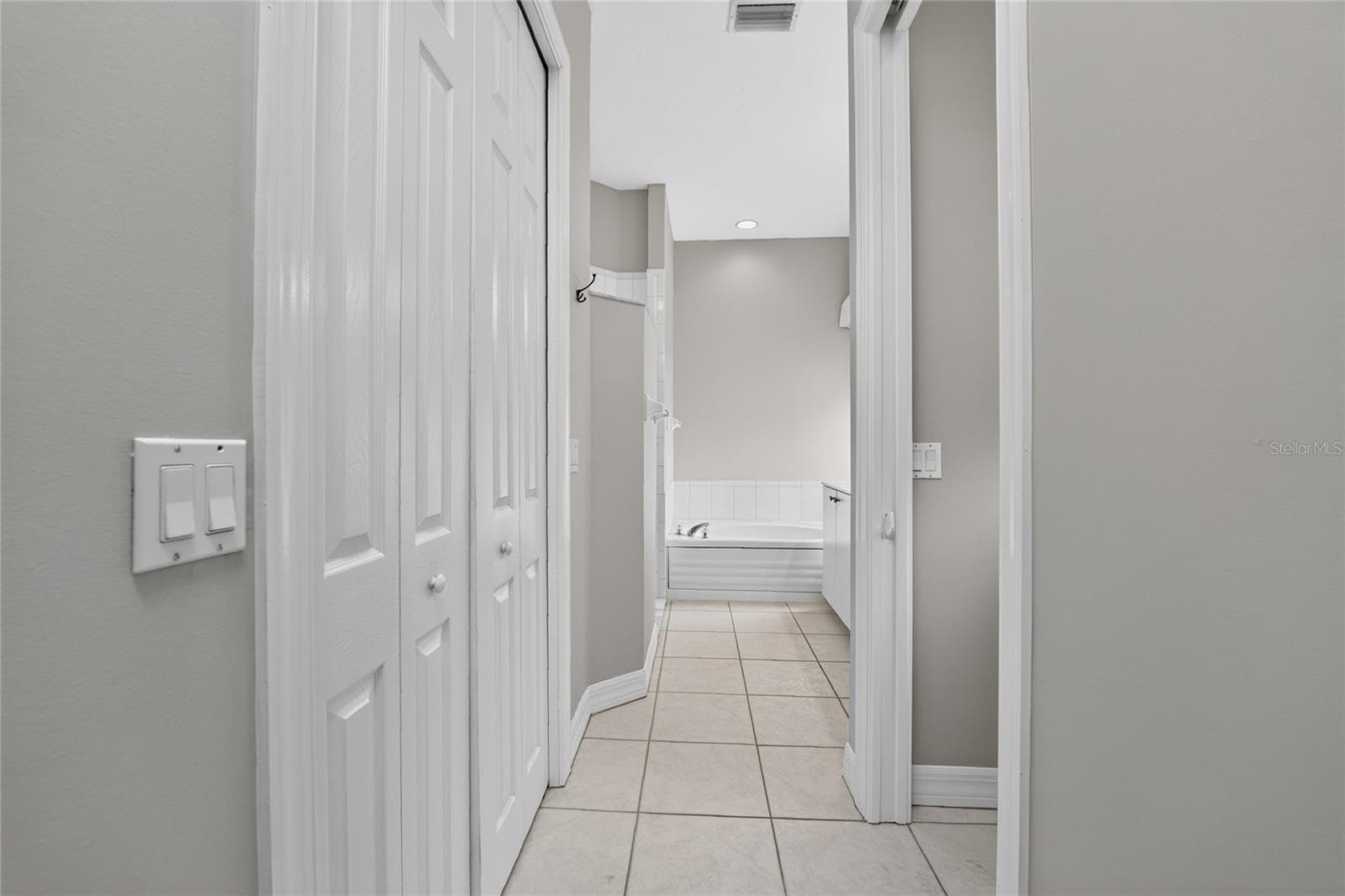 Master bath entry hall from the master bedroom. - 1611 ATARES DRIVE #Unit 111, PUNTA GORDA