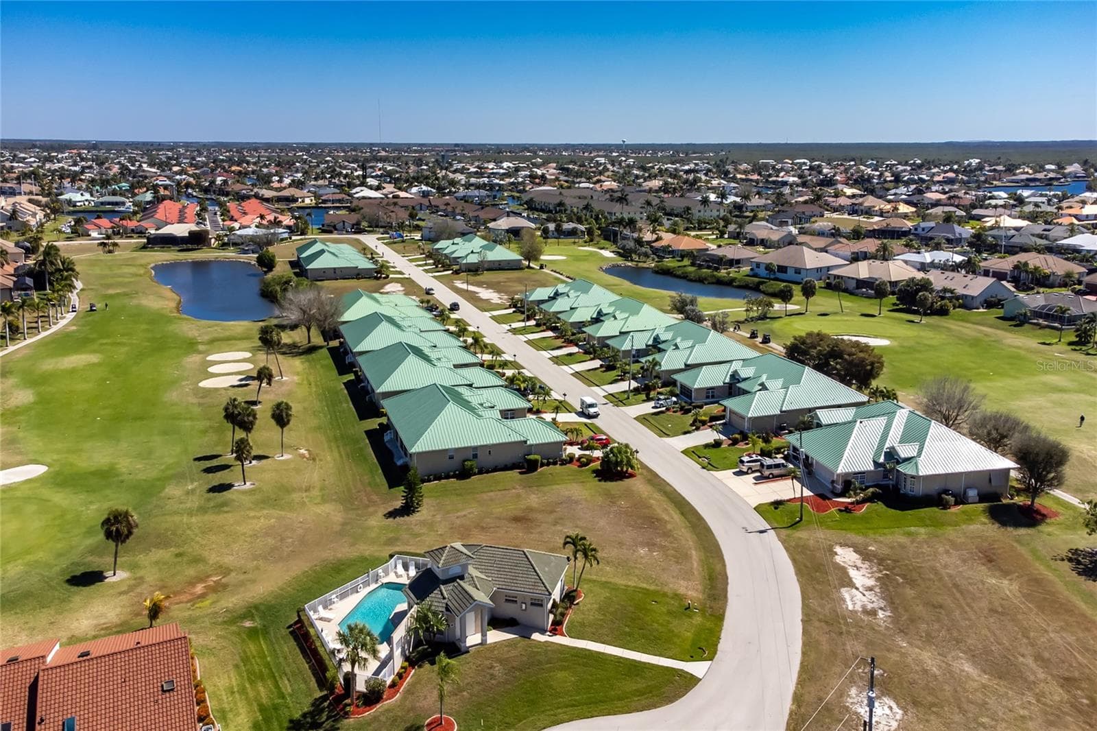 Aerial of The Villas of Versailles and the clubhouse and pool. - 1611 ATARES DRIVE #Unit 111, PUNTA GORDA