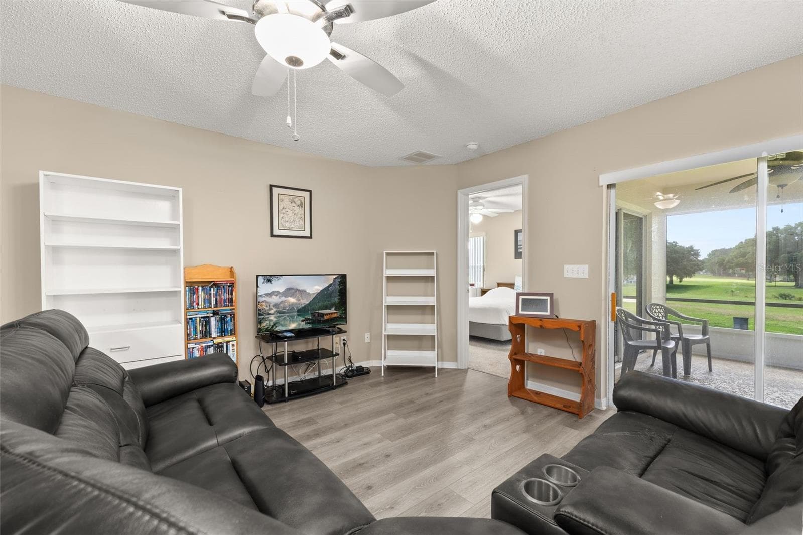 Living room with view looking out towards Screened Patio Area - 3604 KINGSWOOD CT, CLERMONT