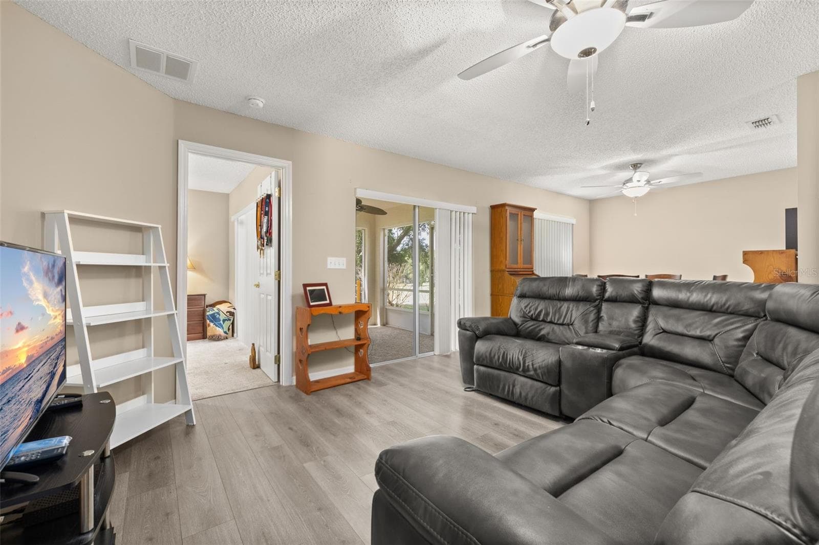 Living Room Area with Dining Area in the background. - 3604 KINGSWOOD CT, CLERMONT