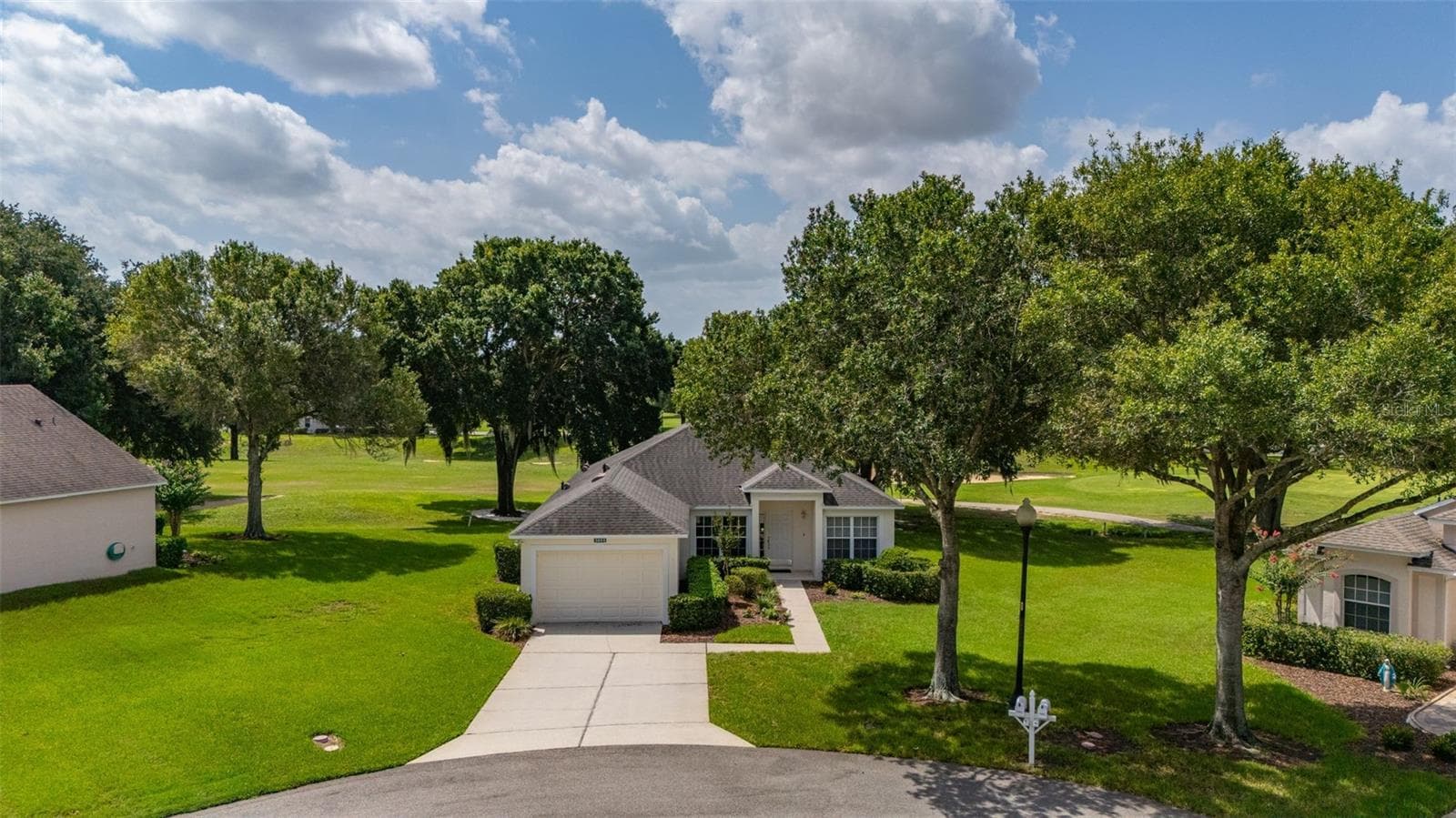 Another View of Front Exterior with Golf Course in the background. - 3604 KINGSWOOD CT, CLERMONT