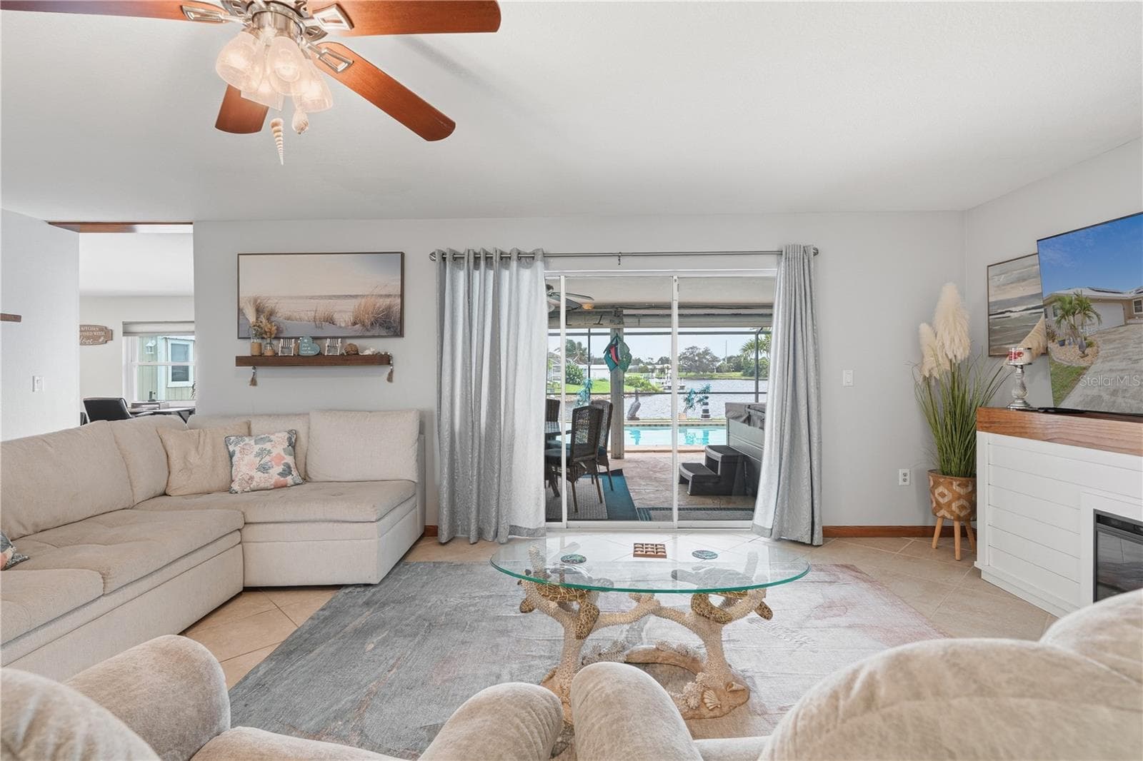 Coastal Living Room Overlooking Pool & Lakefront Views - 2284 BROAD RANCH DR, PORT CHARLOTTE