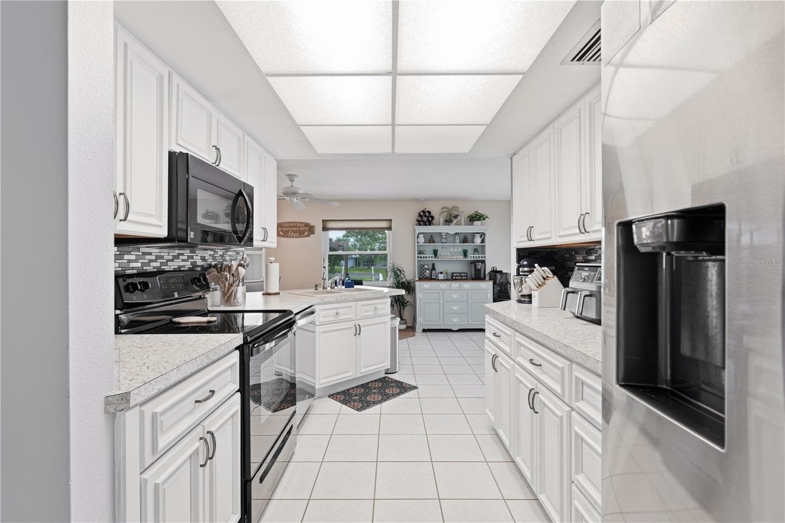 Bright Kitchen with Breakfast Bar and Ample Cabinetry. - 2284 BROAD RANCH DR, PORT CHARLOTTE